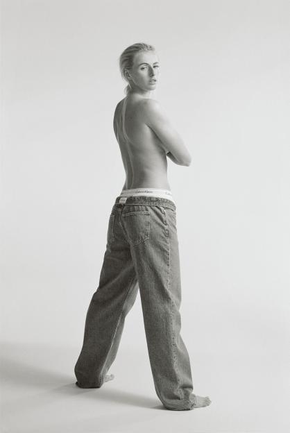 Black and white photo of Chloe Kelly in Calvin Klein underwear and jeans.