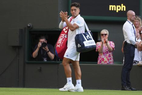 Sebastian Baez of Argentina leaving a tennis court.