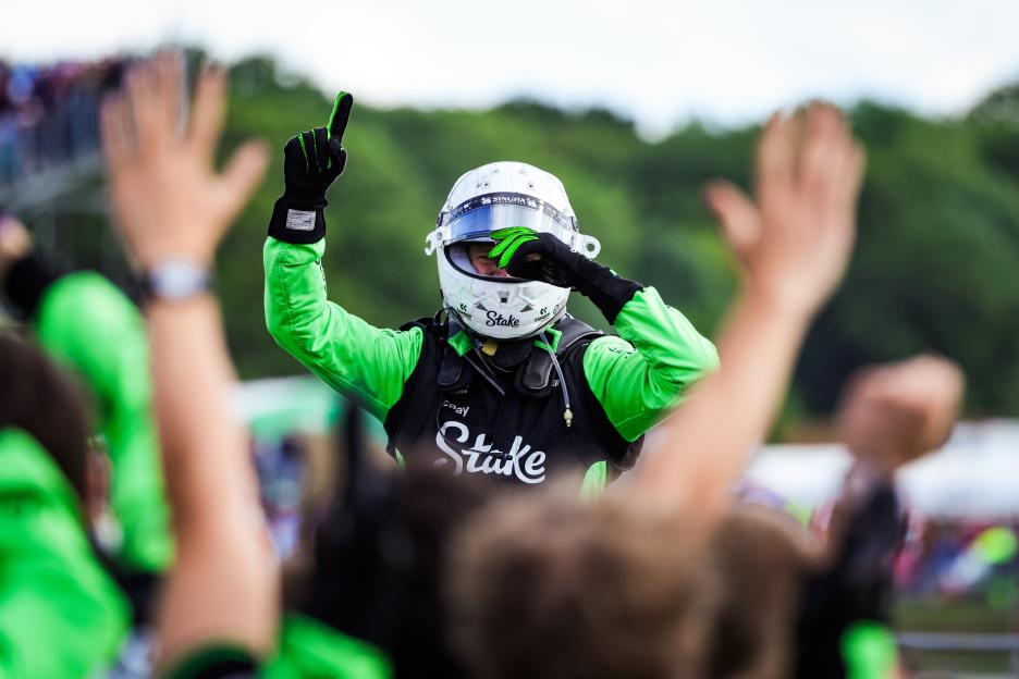 Formula 1 driver Nico Hulkenberg celebrating on the podium.