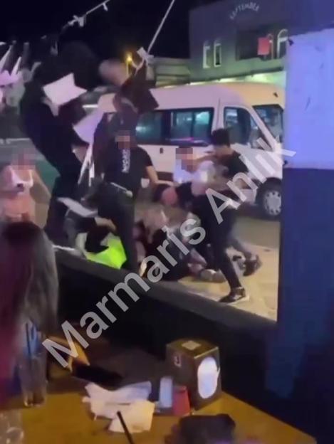 Video showing tourists being beaten up in an establishment.