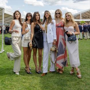 Six women at a polo match.