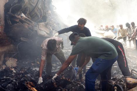 Rescue workers at the site of a plane crash.