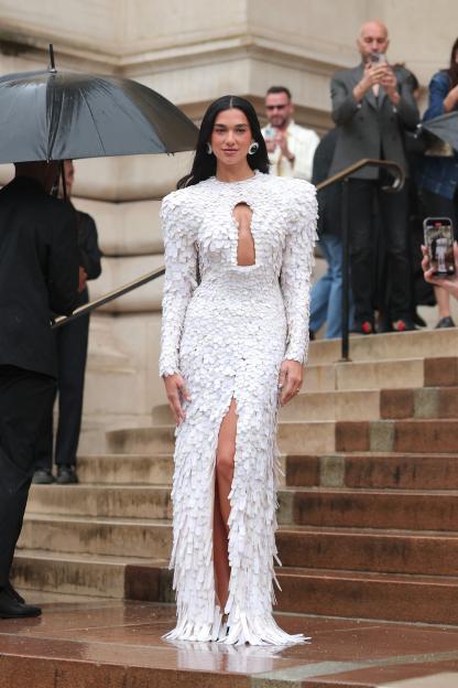 Dua Lipa in a white, feathered gown at Paris Fashion Week.