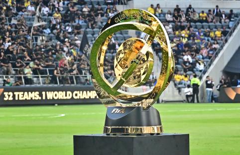 FIFA Club World Cup trophy on display at a stadium.
