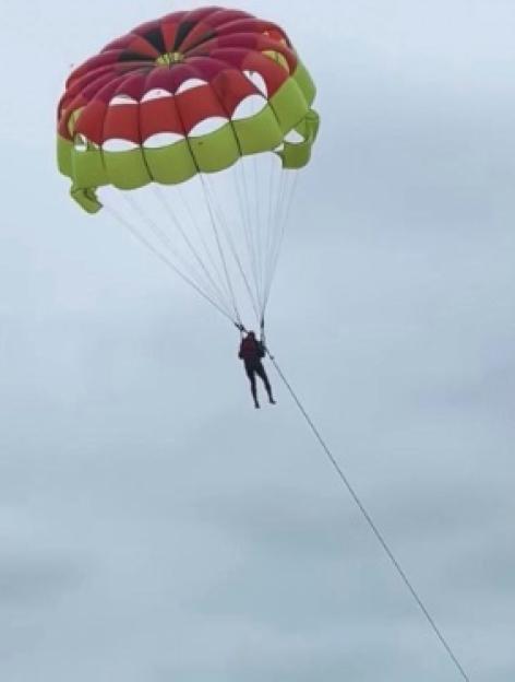 Parasailor in the air.