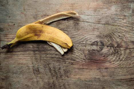 Banana peel on wooden surface.
