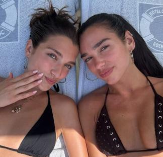 Dua Lipa and her sister Rina Lipa lying down together.