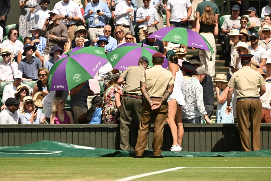 Spectator receiving medical attention at Wimbledon.