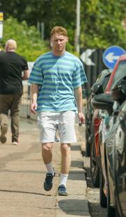 Jamie Borthwick walking down a sidewalk.