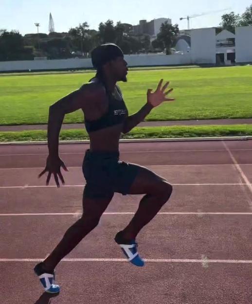 Athlete running on a track.