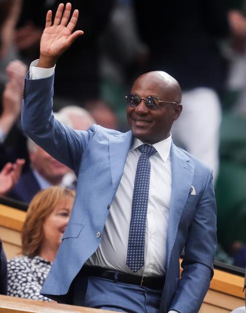 Brian Lara waving from the Royal Box at Wimbledon.