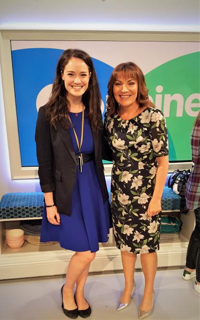 Photo of two women posing together.