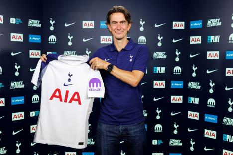 Thomas Frank, new Tottenham Hotspur Head Coach, holding up a team jersey.
