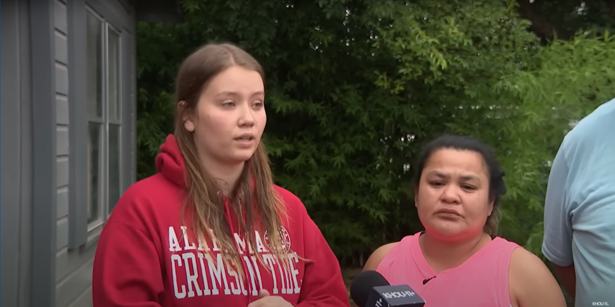 Two women being interviewed after a flood.