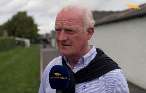 Man being interviewed with a microphone.