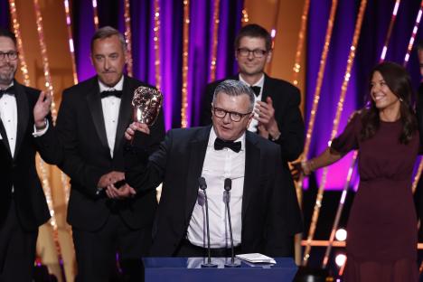 Richard Frediani accepting a BAFTA award.