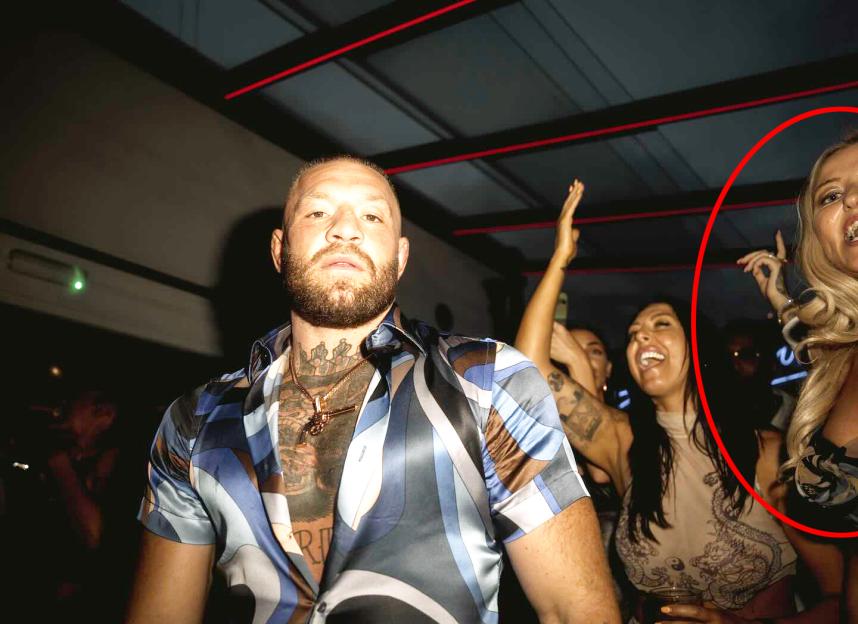 Conor McGregor at a nightclub with other people.