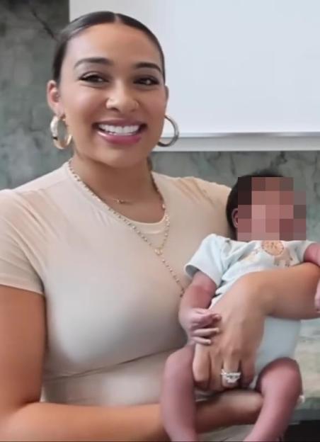 A woman holding a baby.