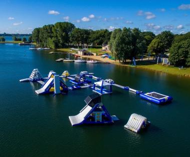 Aerial view of an inflatable aqua park on a lake.