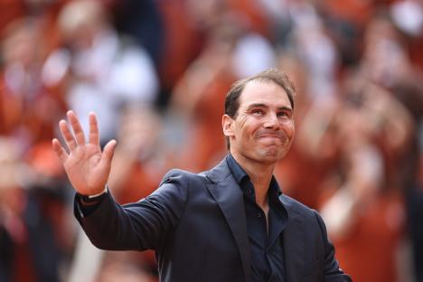 Rafael Nadal waving to a crowd.