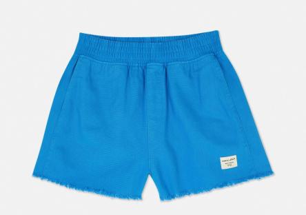 Bright blue denim shorts with frayed edges.