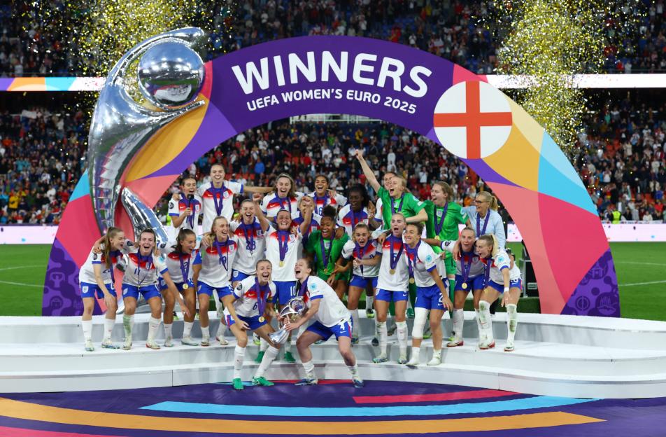 The winning team of the UEFA Women's Euro 2025 celebrates with the trophy.