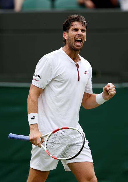 Cameron Norrie of Great Britain celebrates during a tennis match.