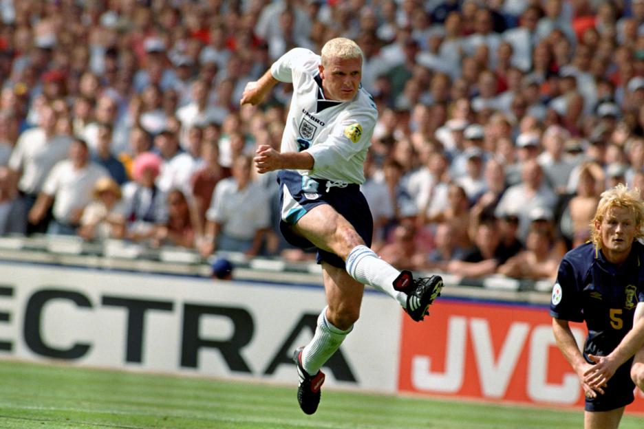 Soccer player kicking the ball during a match.