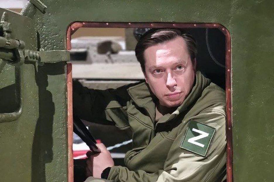 Andrei Klintsevich, Russian military expert, peering out of a military vehicle.