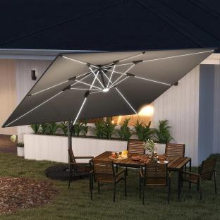 Grey cantilever patio umbrella with solar LED lights over outdoor dining set.