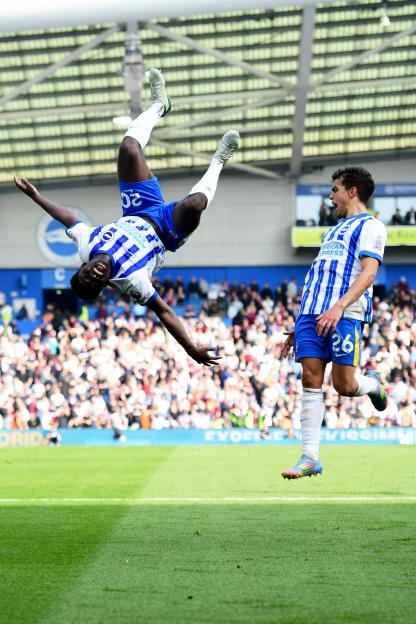 Carlos Baleba of Brighton celebrates a goal with a backflip.