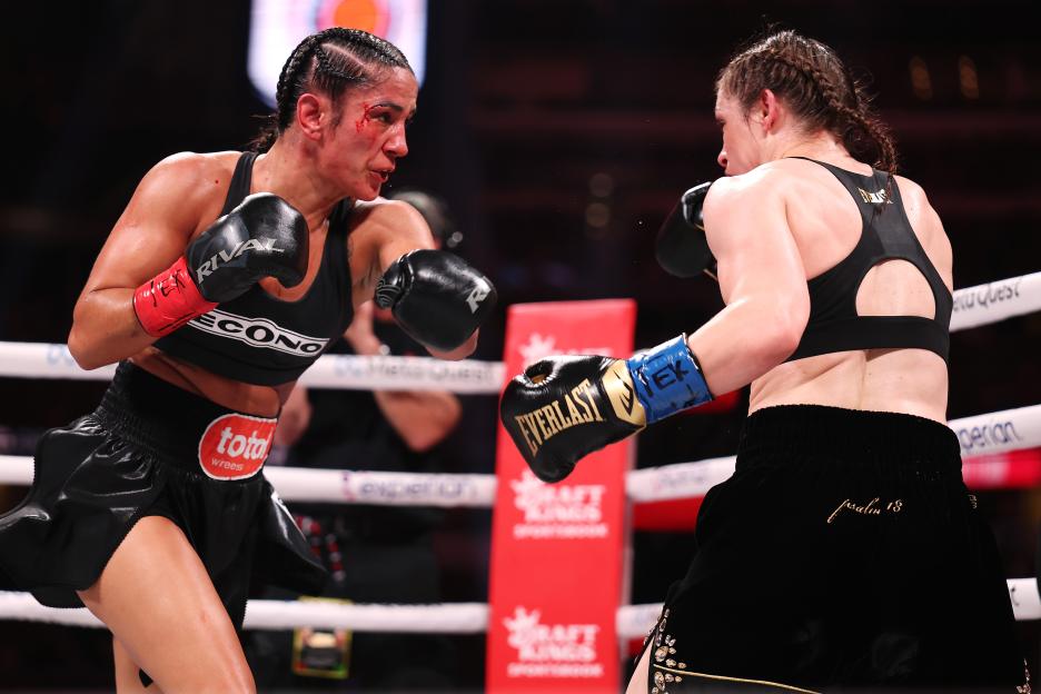 Amanda Serrano and Katie Taylor boxing.