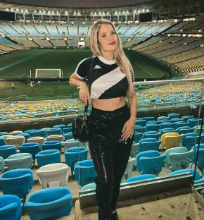 Woman in a soccer stadium.