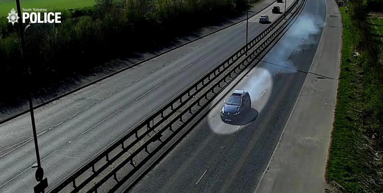 Screengrab from police video showing a car on a highway.