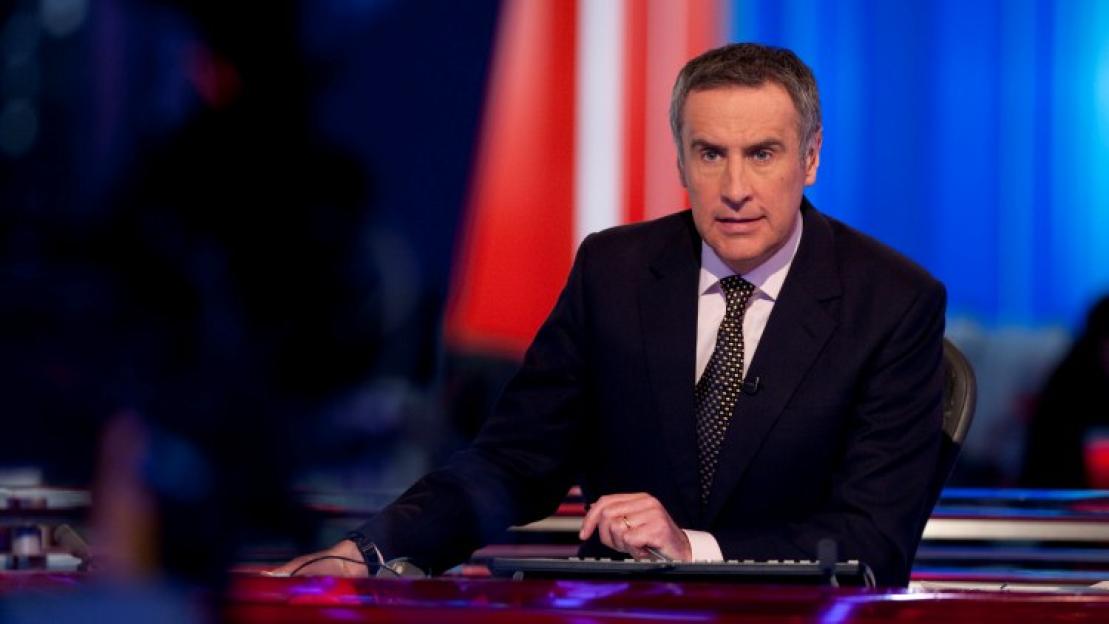 Newsreader Dermot Murnaghan at a newsdesk.