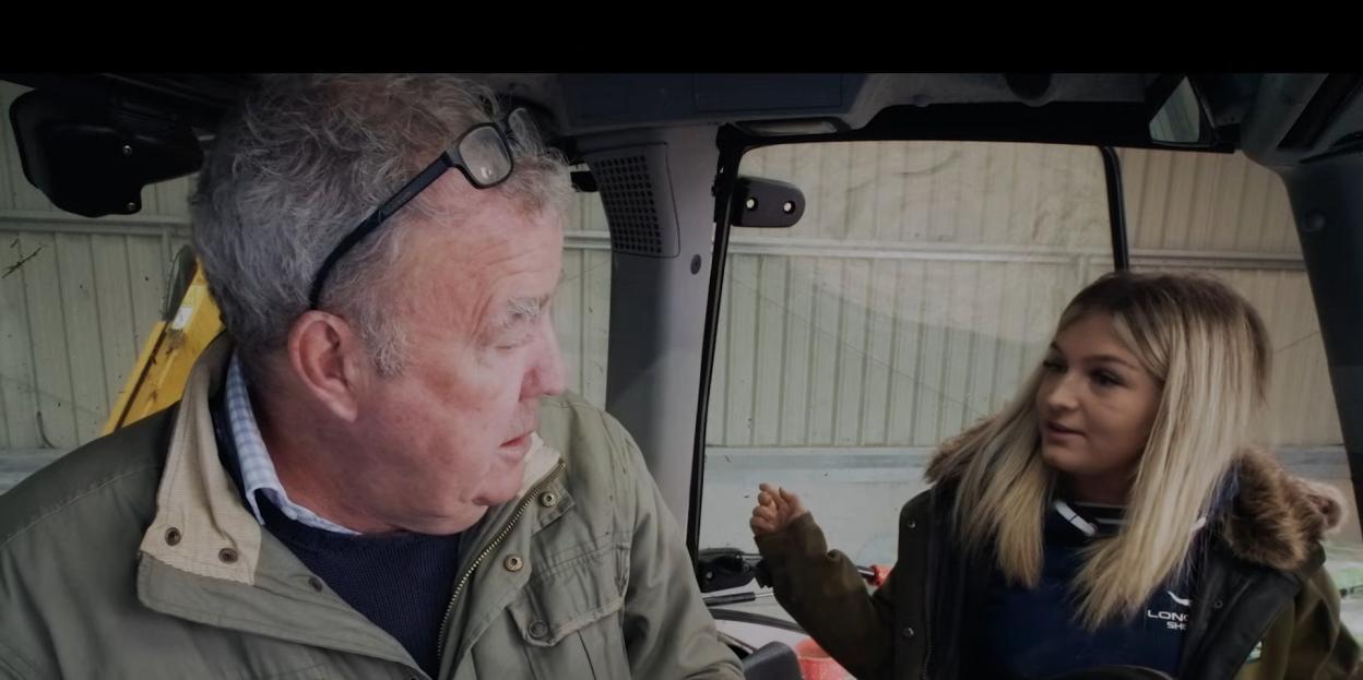 Jeremy Clarkson and his farmhand Harriet Cowan in a tractor.