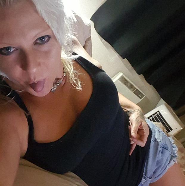 Selfie of a woman sticking out her tongue.