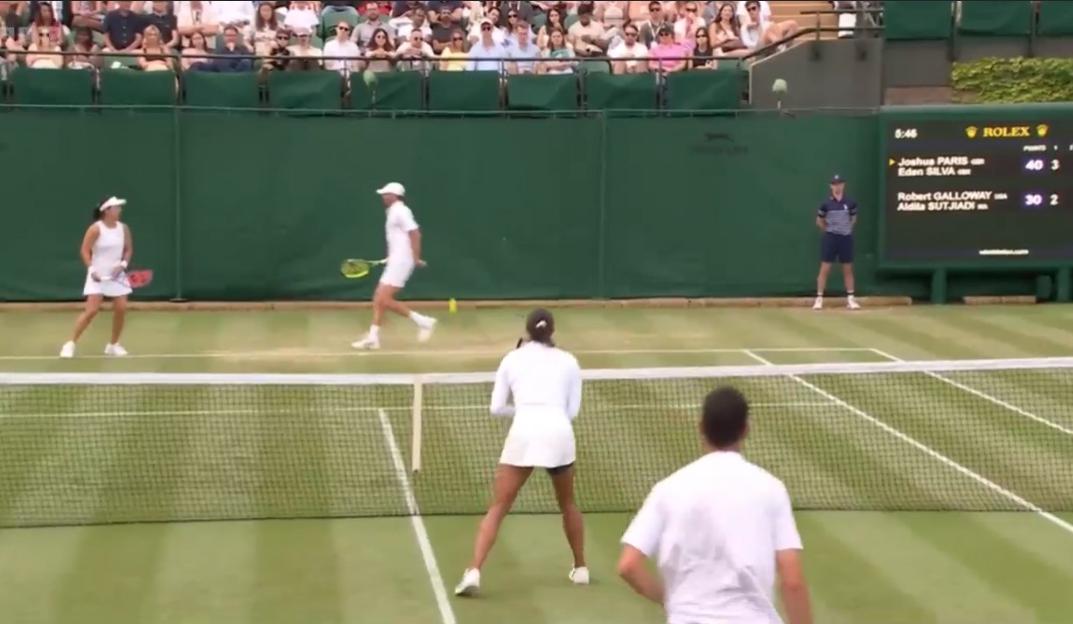 Tennis match in progress.