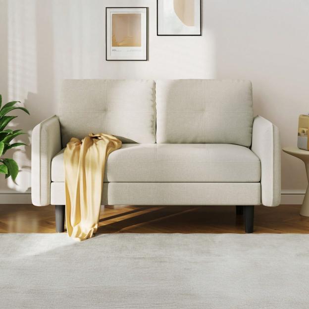 Beige two-seater sofa with a yellow throw.
