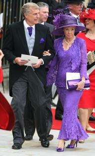 Sir Trevor Brooking and his wife leaving Westminster Abbey after a royal wedding.