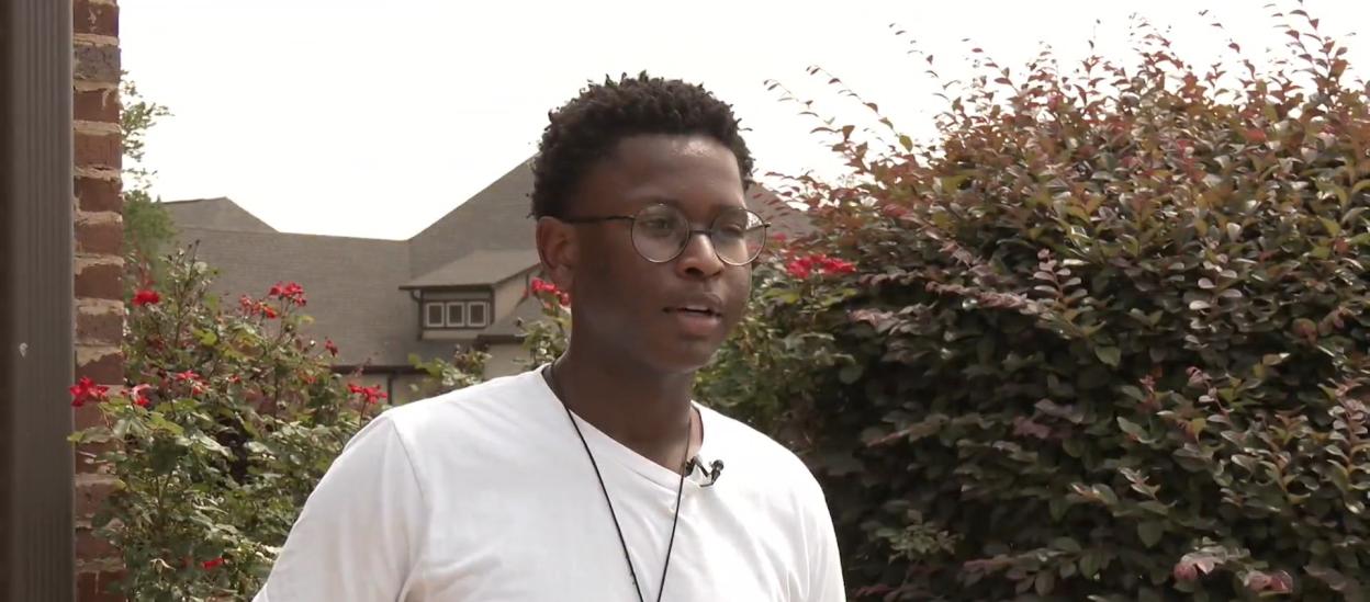 A young man speaks about the search for Reuben Waithaka in Calera.