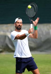 Novak Djokovic practicing tennis.