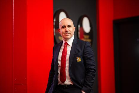 Omar Berrada, CEO of Manchester United, in a suit.