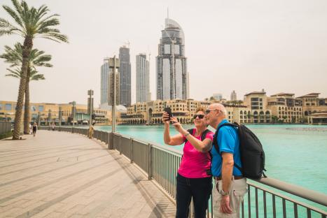 Senior couple taking a selfie in Dubai.