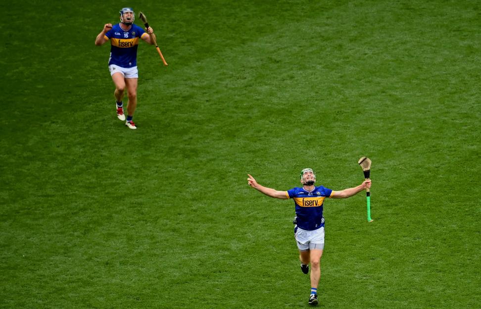 Hurling player Noel McGrath celebrating a point.