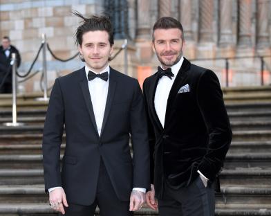 Brooklyn and David Beckham at an event.
