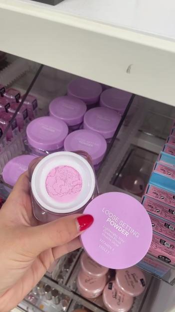 Loose setting powder in a lavender jar.