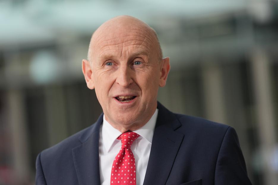 Defense Secretary John Healey giving a media interview.