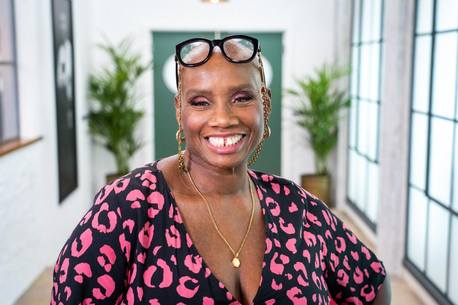 Andi Oliver smiling for a photo.