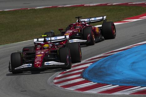 Lewis Hamilton driving a Scuderia Ferrari Formula One race car.